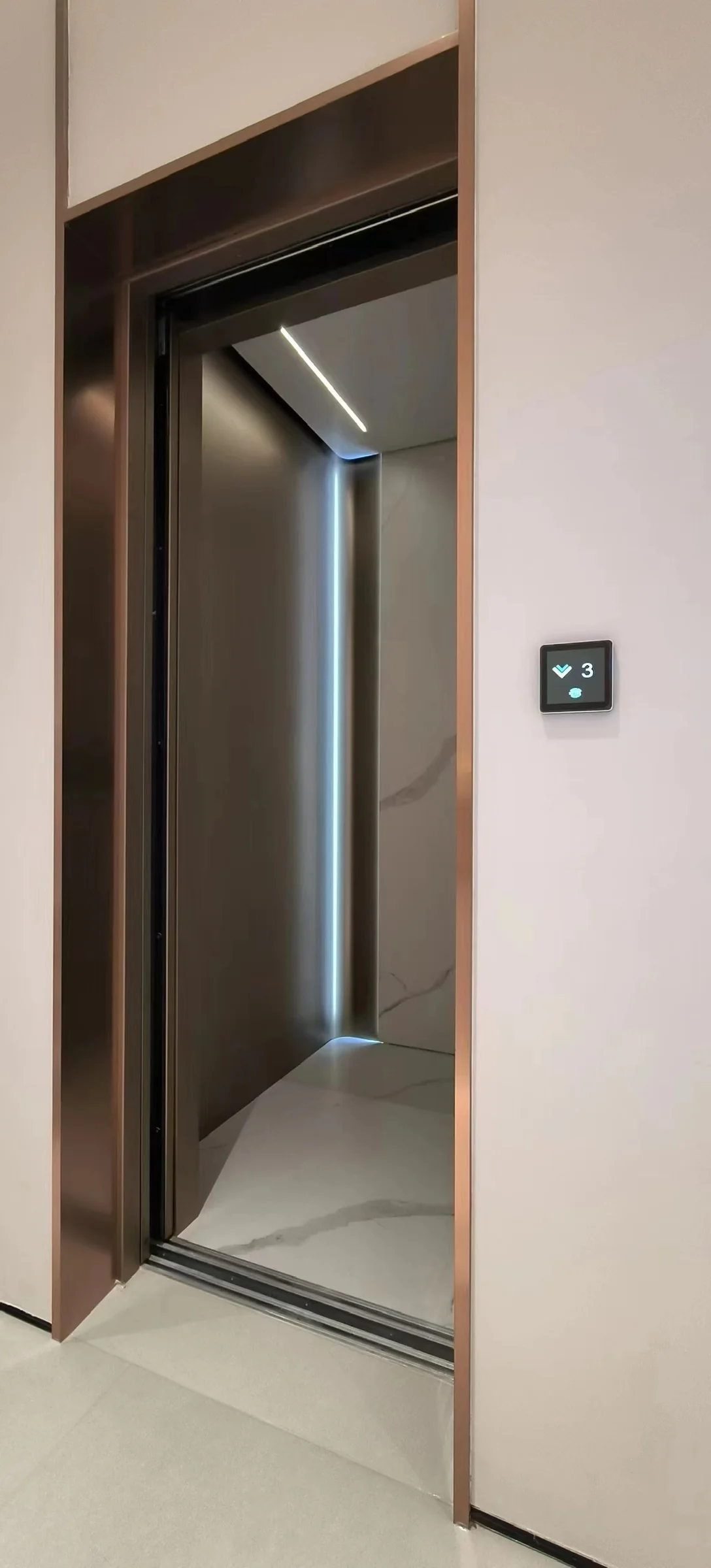 Open passenger lift showing its cabin and entrance